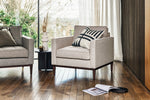 Load image into Gallery viewer, Gray armchair with a striped pillow in a living room setting.