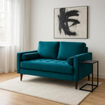 Load image into Gallery viewer, plush teal coloured sofa in a living room