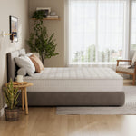 Load image into Gallery viewer, Bedroom with a neatly made bed and decorative elements.