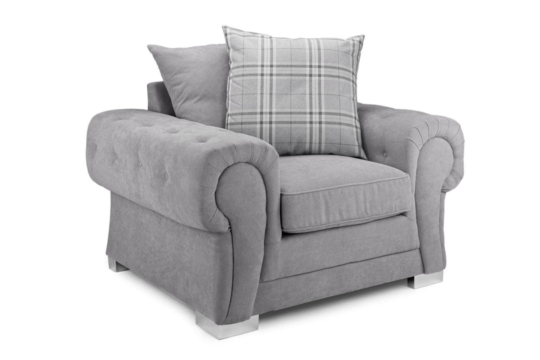Gray armchair with a plaid cushion on a white background