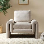 Load image into Gallery viewer, Beige armchair in a room with a plant and framed picture on the wall.