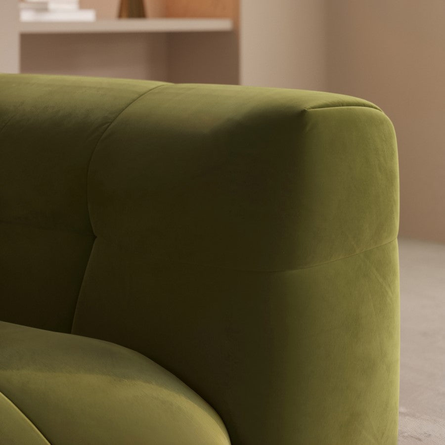 green color single seater sofa placed in a living room