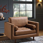 Load image into Gallery viewer, Brown leather armchair in a room with a large window and decorative elements.