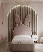 Load image into Gallery viewer, Children's bed with bunny ears and bow design in a stylish room.