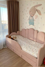 Load image into Gallery viewer, Children's room with a pink bed, teddy bears, and a wall with a bunny illustration.