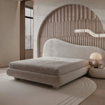 Load image into Gallery viewer, Modern bedroom with a beige bed and decorative wall.