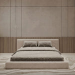 Load image into Gallery viewer, Beige bed in a room with wooden paneling