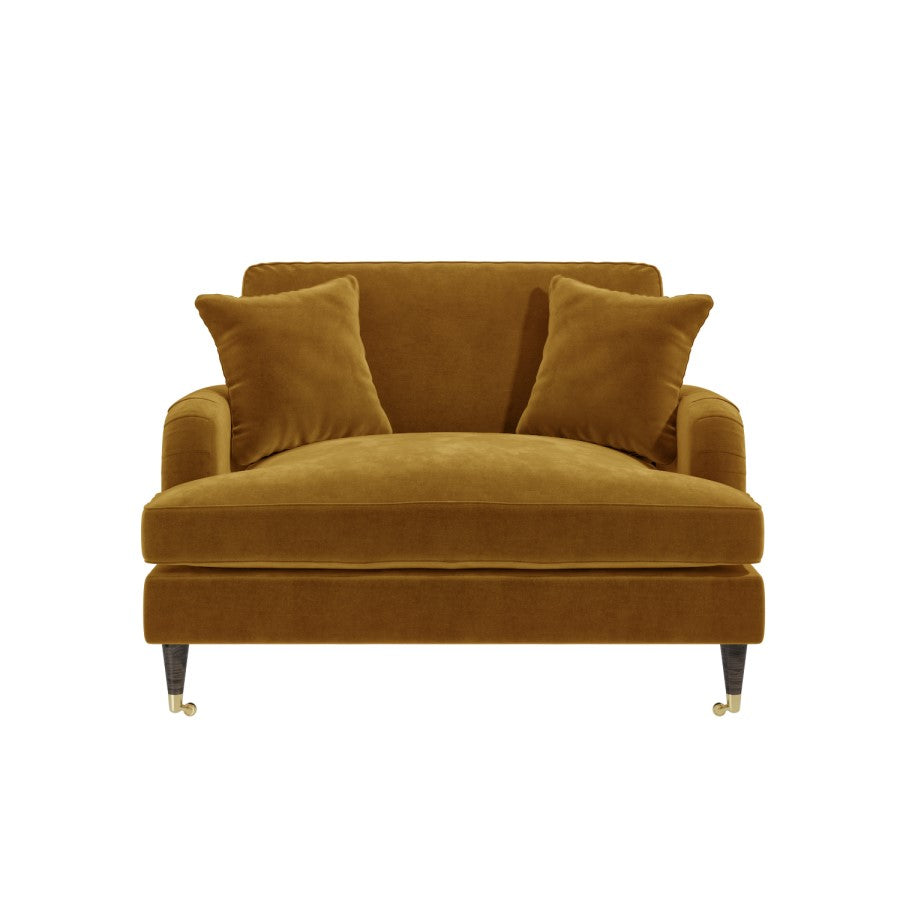 Brown velvet sofa with two cushions on a white background