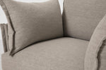 Load image into Gallery viewer, Close-up of a beige fabric armchair with a pillow.