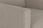 Load image into Gallery viewer, Close-up of a beige fabric sofa corner