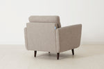 Load image into Gallery viewer, Beige armchair on a white floor with a white wall background