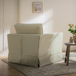 Load image into Gallery viewer, Striped armchair in a living room setting with a small table and decorative items.