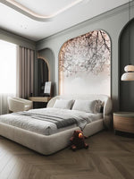 Load image into Gallery viewer, Modern bedroom with a large bed, plush toys, and decorative wall art.