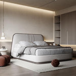 Load image into Gallery viewer, Modern bedroom with a gray bed and minimal decor