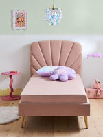Load image into Gallery viewer, Pink shell-shaped bed in a child's room with a side table and decorative items.