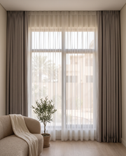 Blackout and sheer curtains on a living room window – Dune & Pine