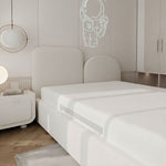 Load image into Gallery viewer, Modern bedroom with a bed, nightstand, and wall decal of an astronaut.