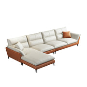 White sectional sofa with brown leather accents on a white background