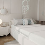 Load image into Gallery viewer, Neatly made bed with decorative pillows in a bedroom setting.