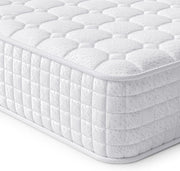 White quilted mattress on a white background