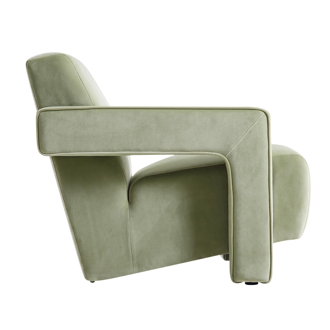 Modern green armchair on a white background