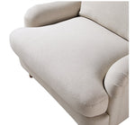 Load image into Gallery viewer, Beige sofa with a focus on the armrest and backrest on a white background
