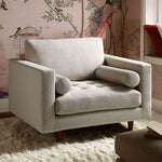 Load image into Gallery viewer, Gray armchair in a room with floral wallpaper

