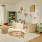 Load image into Gallery viewer, Children's bedroom with a beige sofa, colorful pillows, and a green bookshelf.