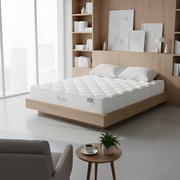 White mattress on a wooden bed frame in a modern bedroom with bookshelves and decor.