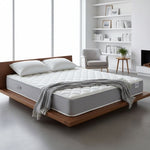 Load image into Gallery viewer, Gray mattress on a wooden bed frame in a modern bedroom setting.