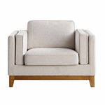 Load image into Gallery viewer, Beige armchair with wooden legs on a white background
