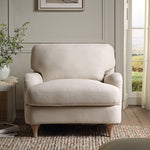 Load image into Gallery viewer, Beige armchair in a room with a window and plant
