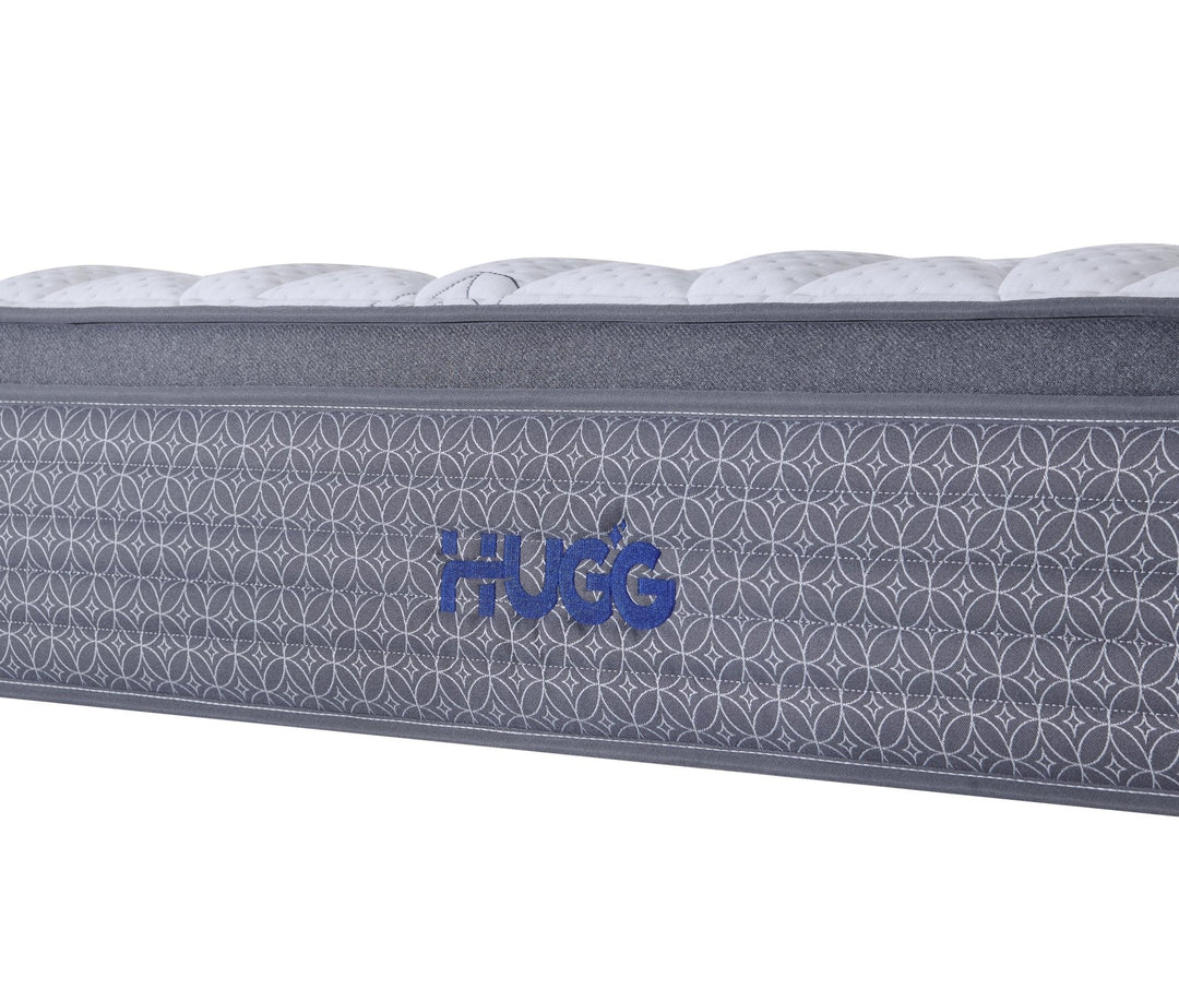 Gray mattress with 'Hugg' branding on a white background