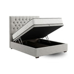Load image into Gallery viewer, Gray upholstered bed with open storage compartment on a white background