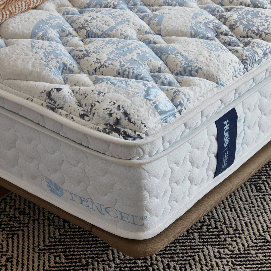 Mattress with quilted pattern and 'Fenchel' branding on a textured surface