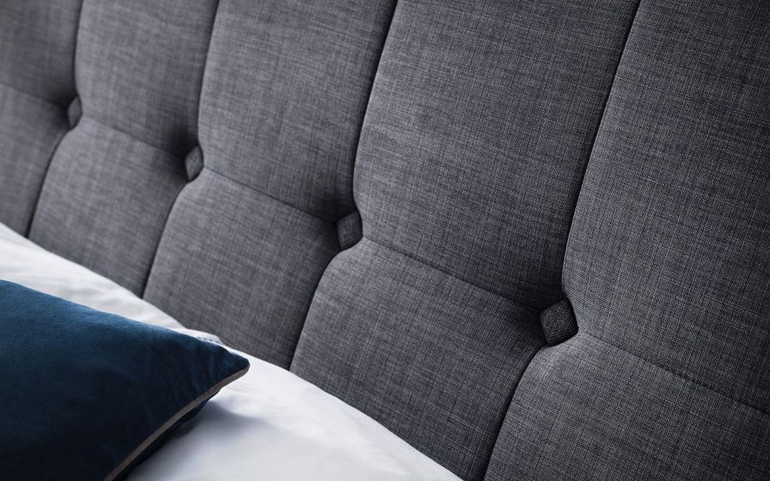 close up a a bed in grey color