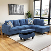Blue sectional sofa with ottoman in a living room setting.