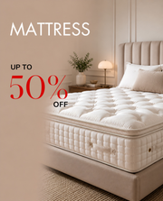 Mattress with promotional text 'Up to 50% off' in a bedroom setting.