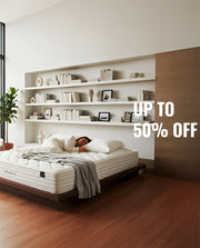 Person lying on a mattress with a shelf above in a modern bedroom, promotional text overlay.