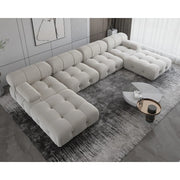 Gray sectional sofa in a modern living room setting with a coffee table.