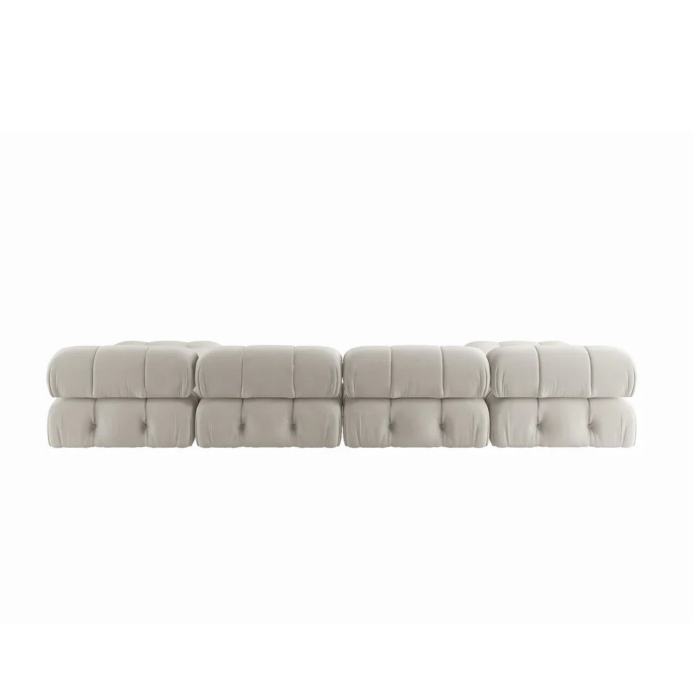 Beige tufted sofa on a white background