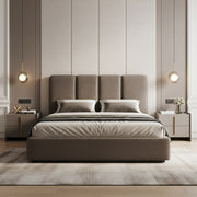 Modern bedroom with a large bed, nightstands, and wall lights.