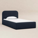 Load image into Gallery viewer, Navy bed frame with white mattress and pillow on a beige background