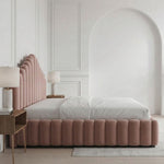Load image into Gallery viewer, Pink velvet bed in a stylish bedroom with white walls and wooden flooring.