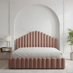 Load image into Gallery viewer, Pink upholstered bed in a stylish bedroom setting with a white archway.