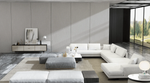 Load image into Gallery viewer, Modern living room with a white sectional sofa, gray ottomans, and a coffee table.

