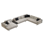 Load image into Gallery viewer, Gray sectional sofa with black and white pillows on a white background
