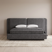 Slate Luxe upholstered bed with dual headboard and hydraulic storage in a bright bedroom, front view