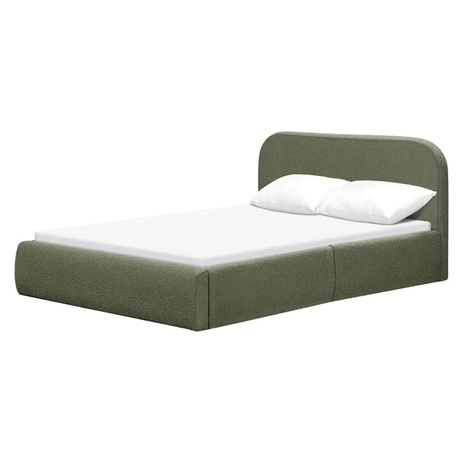 An upholstered bed frame in sage green fabric, shown with a white mattress and two white pillows against a plain white background.