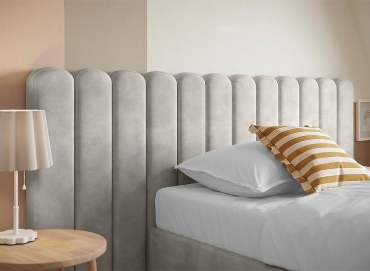 headboard of a bed in a bed room